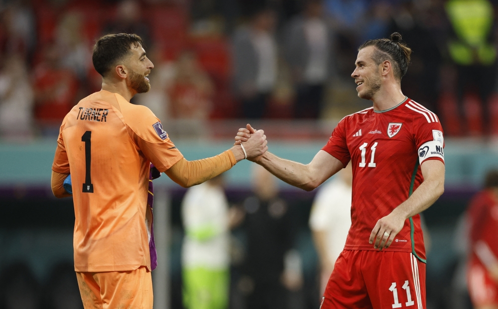 Wales' Gareth Bale shakes hands with Matt Turner of the US after their FIFA World Cup Qatar 2022 Group B match at the Ahmad Bin Ali Stadium, Al Rayyan, Qatar, on November 22, 2022.  REUTERS/John Sibley