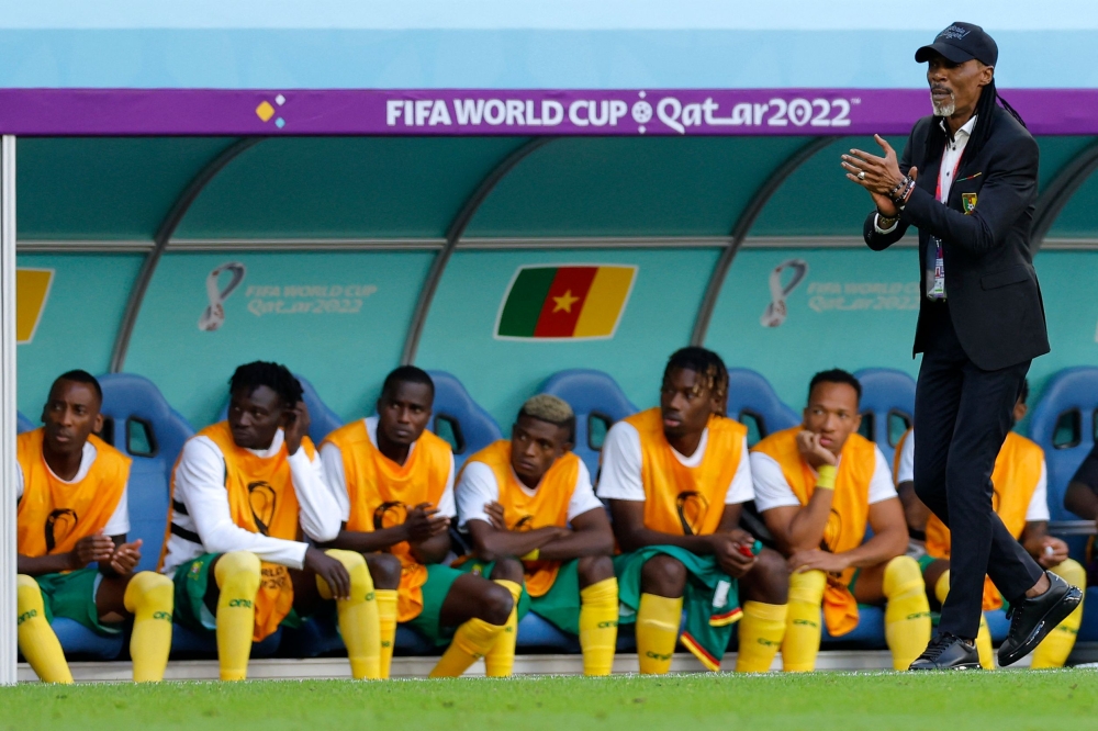 Cameroon's coach Rigobert Song gestures alongside his bench during the Qatar 2022 World Cup Group G football match between Switzerland and Cameroon at the Al-Janoub Stadium in Al-Wakrah, south of Doha on November 24, 2022. (Photo by Odd ANDERSEN / AFP)