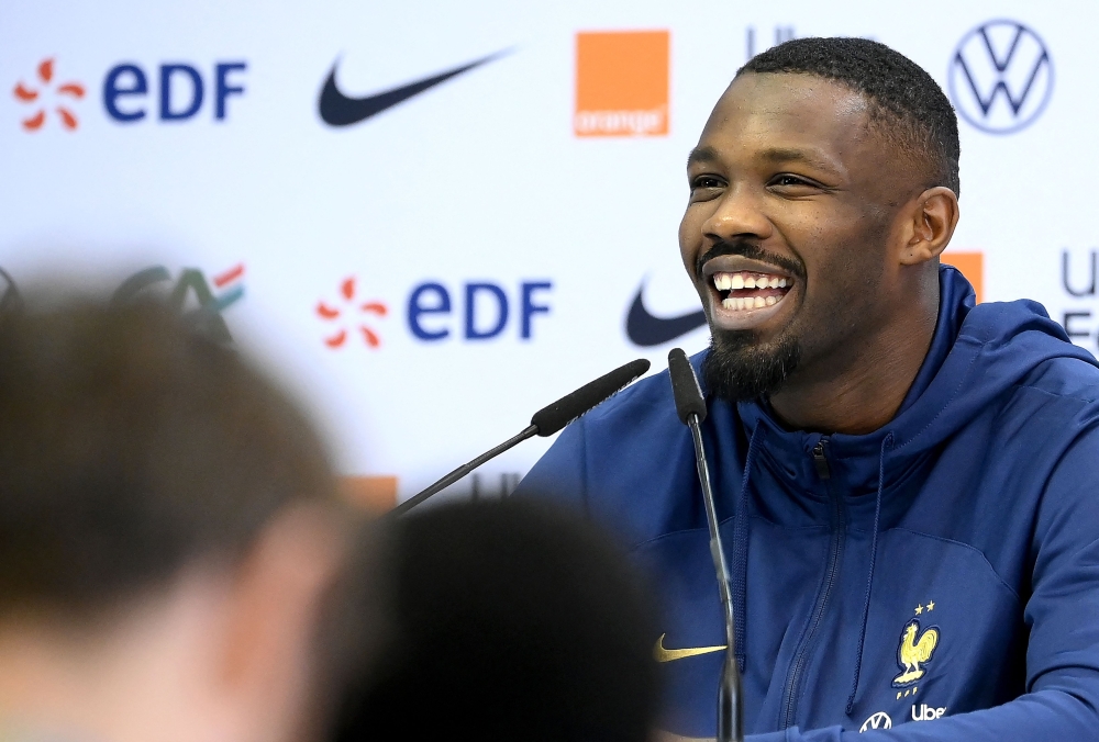 France's forward Marcus Thuram smiles during a press conference at the Jassim-bin-Hamad Stadium in Doha on November 24 , 2022, during the Qatar 2022 World Cup football tournament. (Photo by FRANCK FIFE / AFP)