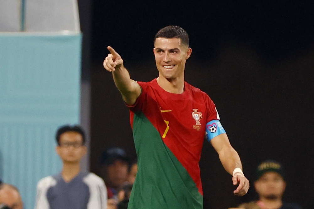 Cristiano Ronaldo celebrates scoring their first goal during the Qatar 2022 World Cup Group H football match between Portugal and Ghana at Stadium 974 in Doha on November 24, 2022. (REUTERS/Hannah Mckay)
