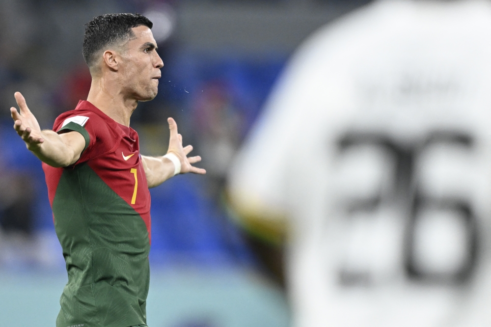 Portugal's forward Cristiano Ronaldo reacts during the Qatar 2022 World Cup Group H football match between Portugal and Ghana at Stadium 974 in Doha on November 24, 2022. (Photo by PATRICIA DE MELO MOREIRA / AFP)
 