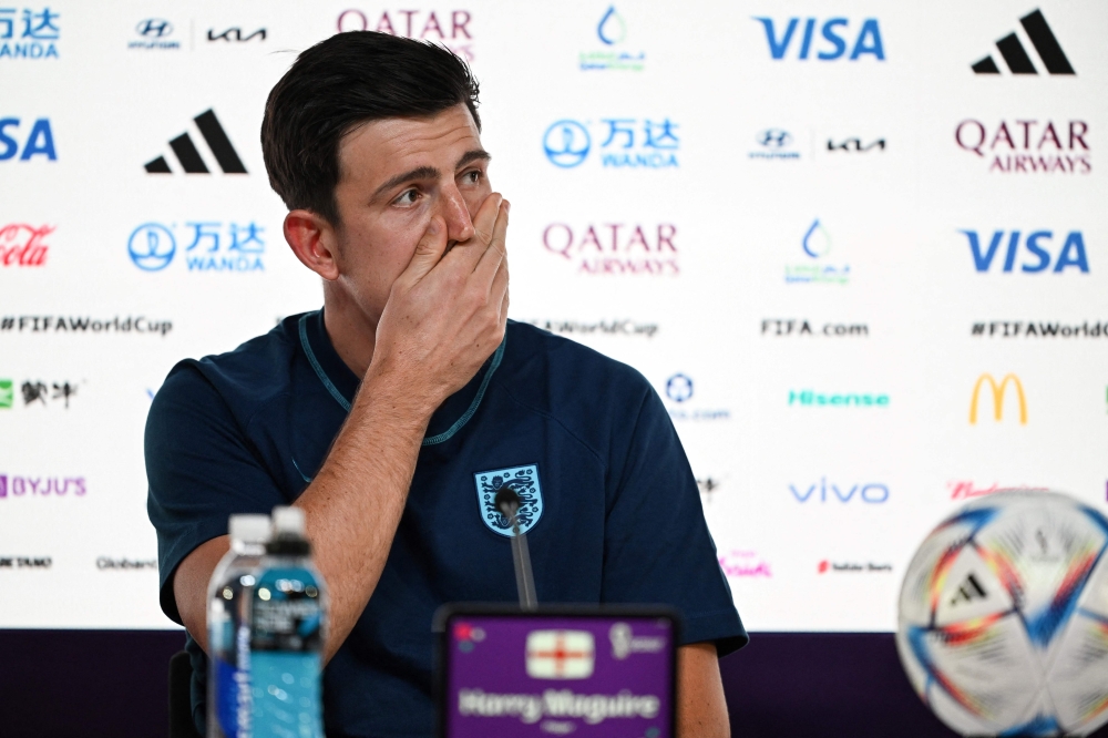 England's defender Harry Maguire addresses a press conference at the Qatar National Convention Center (QNCC) in Doha on November 24, 2022, on the eve of the Qatar 2022 World Cup football match between England and USA. (Photo by Paul ELLIS / AFP)