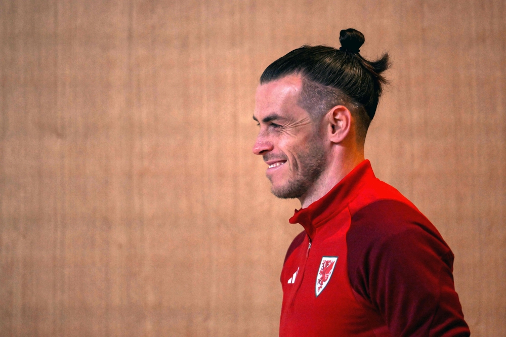 Wales' forward Gareth Bale arrives for a press conference at the Qatar National Convention Center (QNCC) in Doha on November 24, 2022, on the eve of the Qatar 2022 World Cup football match between Wales and Iran. (Photo by Nicolas TUCAT / AFP)