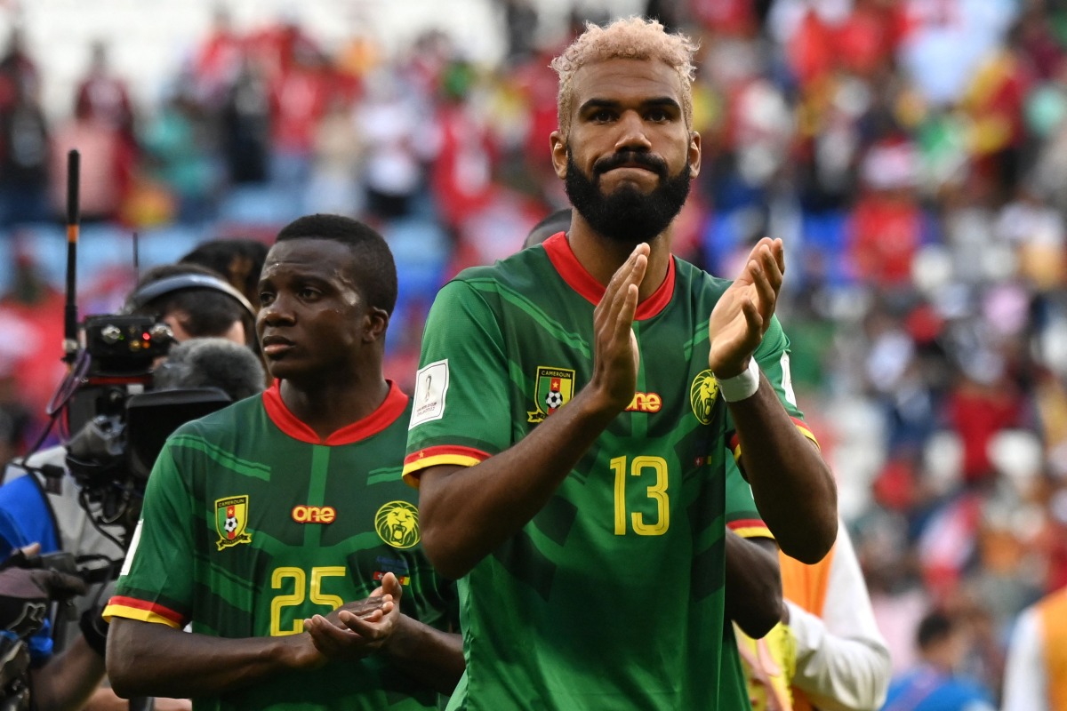 Cameroon’s defender Nouhou Tolo and forward  Eric Maxim Choupo-Moting applaud after their match against Switzerland. AFP