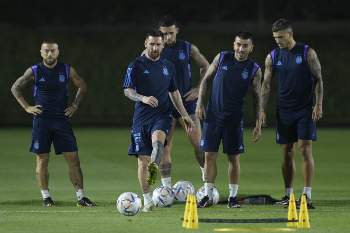 Argentina’s forward Lionel Messi (second left) takes part in a training session with team-mates at the Qatar University training site yesterday. AFP