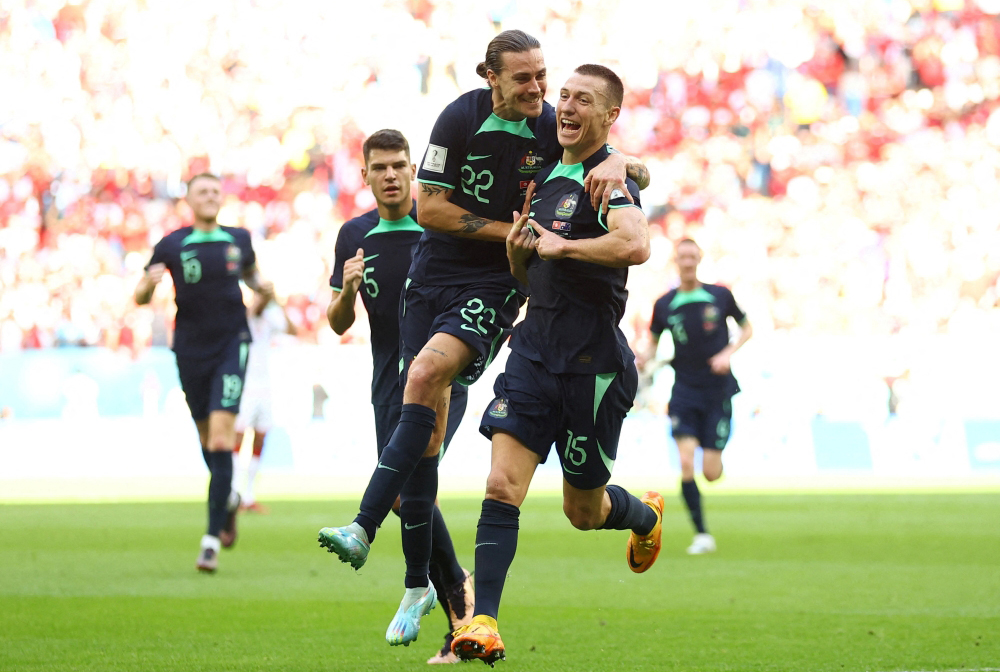 Australia's Mitchell Duke celebrates scoring their first goal with Jackson Irvine REUTERS/Hannah Mckay