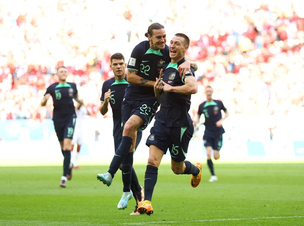 Australia's Mitchell Duke celebrates scoring the only goal of the FIFA World Cup Qatar 2022 Group D match against Tunisia with Jackson Irvine at the Al Janoub Stadium, Al Wakrah, Qatar, on November 26, 2022.  REUTERS/Hannah Mckay