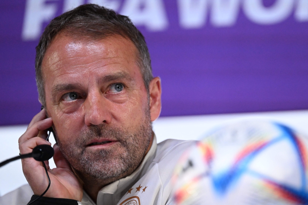 Germany's coach #00 Hans-Dieter Flick attends a press conference at the Qatar National Convention Center (QNCC) in Doha on November 26, 2022, on the eve of the Qatar 2022 World Cup football match between Spain and Germany. (Photo by Ina Fassbender / AFP)