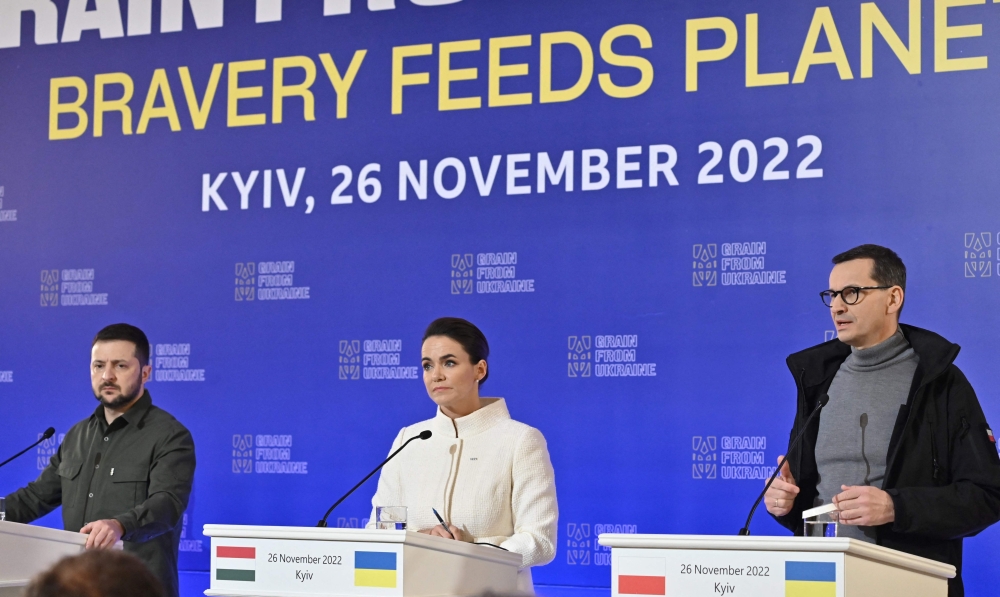 Ukraine's President Volodymyr Zelensky, Hungary's President Katalin Novak and Poland's Prime Minister Mateusz Morawiecki attend a press briefing after the International Summit on Food Security in Kyiv on November 26, 2022, amid the Russian invasion of Ukraine. (Photo by Genya SAVILOV / AFP)