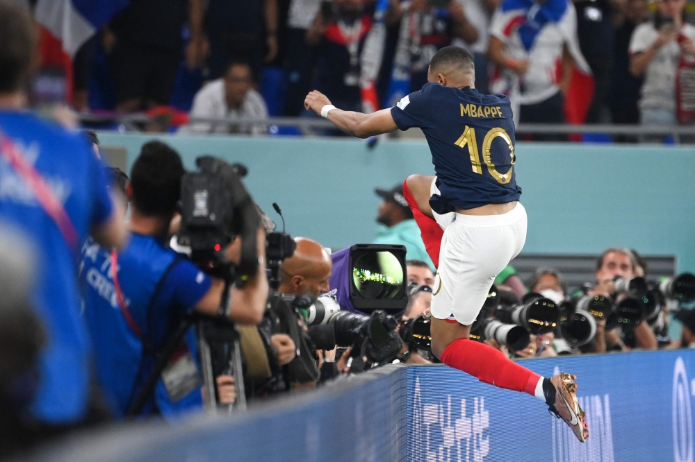 France's forward #10 Kylian Mbappe celebrates scoring his team's second goal during the Qatar 2022 World Cup Group D football match between France and Denmark at Stadium 974 in Doha on November 26, 2022. (Photo by FRANCK FIFE / AFP)