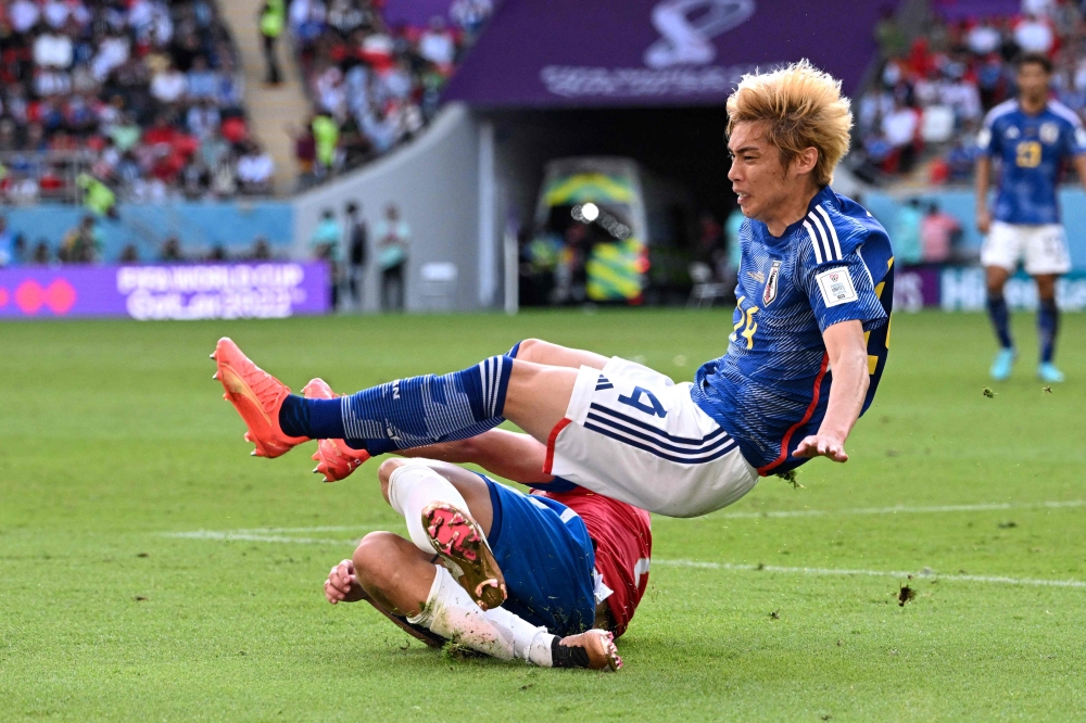 Japan's midfielder Junya Ito in action during the Qatar 2022 World Cup Group E football match between Japan and Costa Rica at the Ahmad Bin Ali Stadium in Al-Rayyan, west of Doha, on November 27, 2022. (AFP/Anne-Christine Poujoulat)