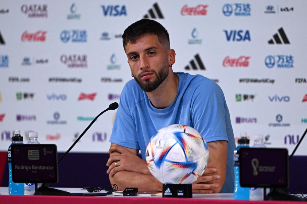 Uruguay's midfielder Rodrigo Bentancur attends a press conference at the Qatar National Convention Center (QNCC) in Doha on November 27, 2022, on the eve of the Qatar 2022 World Cup football match between Portugal and Uruguay. (Photo by Pablo PORCIUNCULA / AFP)