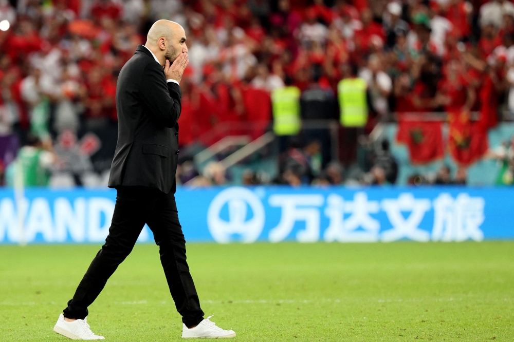 Morocco's coach Walid Regragui reacts at the end of the Qatar 2022 World Cup Group F football match between Belgium and Morocco at the Al-Thumama Stadium in Doha on November 27, 2022. (Photo by JACK GUEZ / AFP)
