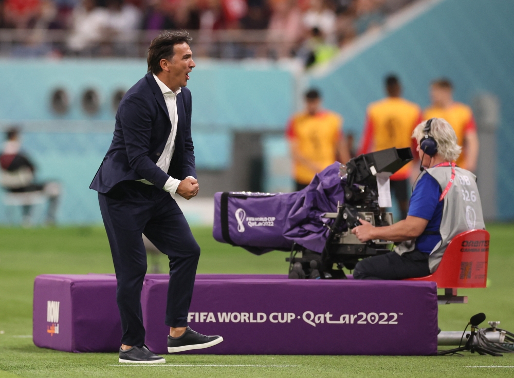 Croatia coach Zlatko Dalic celebrates after Marko Livaja scores their second goal during the Qatar 2022 World Cup Group F football match between Croatia and Canada at the Khalifa International Stadium on November 27, 2022. (Reuters/Carl Recine)