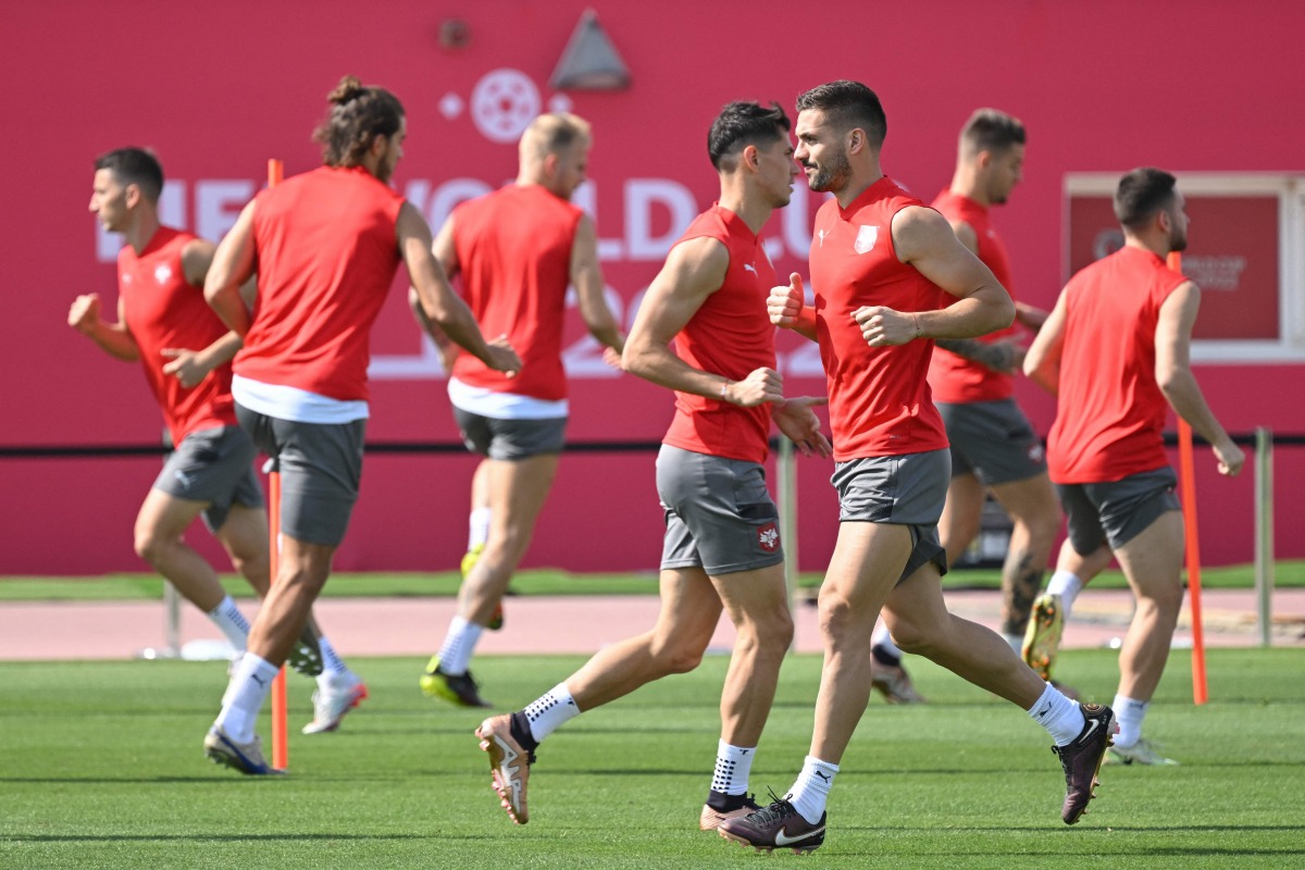 Serbia’s forward Dusan Tadic with teammates during a training session at the Al Arabi SC, yesterday. AFP