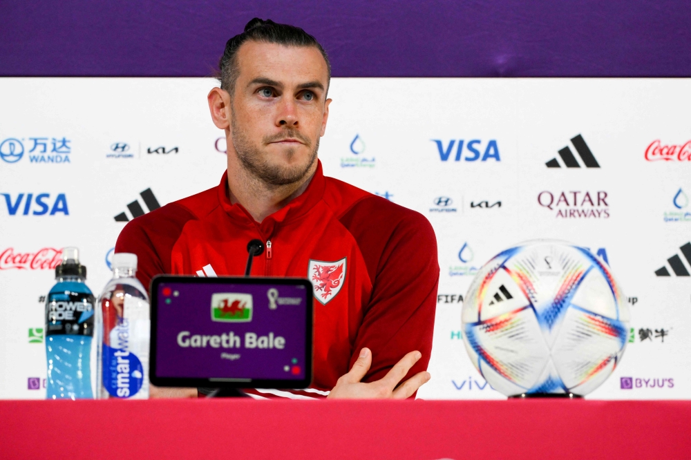 Wales' forward Gareth Bale addresses a press conference at the Qatar National Convention Center (QNCC) in Doha on November 28, 2022, on the eve of the Qatar 2022 World Cup football match between Wales and England. (Photo by Nicolas TUCAT / AFP)