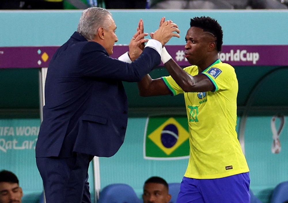 Brazil coach Tite with Vinicius Junior during the Qatar 2022 World Cup Group G football match between Brazil and Switzerland at Stadium 974 on November 28, 2022. (Reuters/Pedro Nunes)