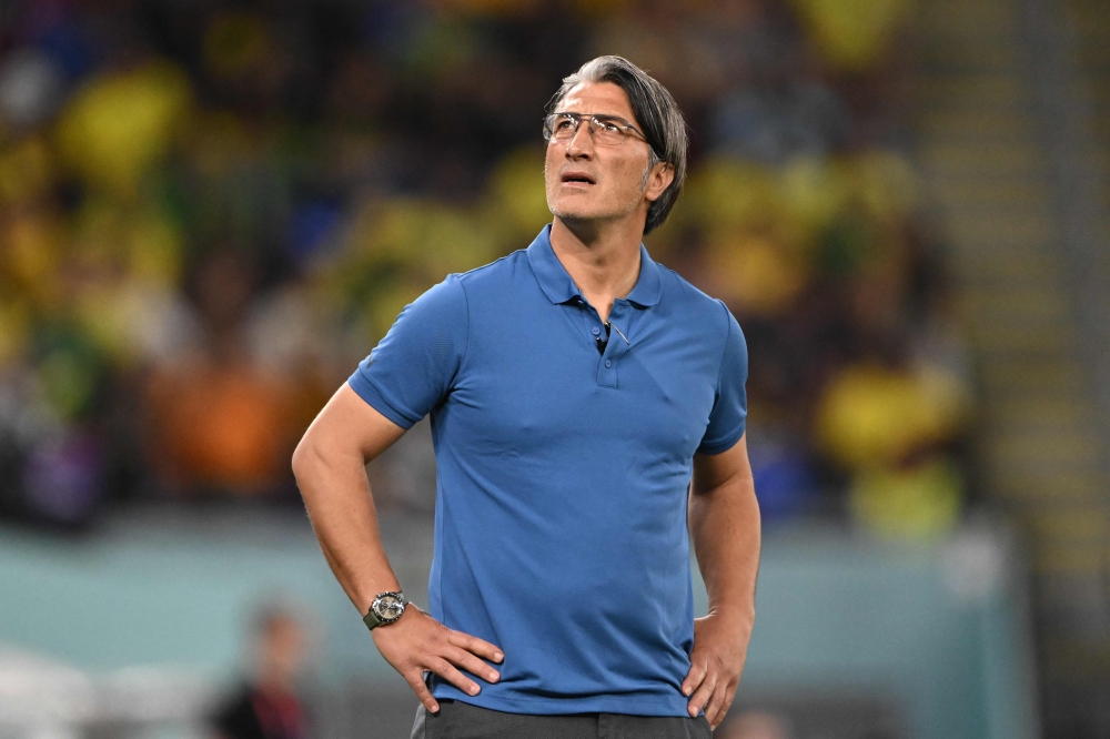 Switzerland's coach Murat Yakin looks at supporters during the Qatar 2022 World Cup Group G match between Brazil and Switzerland at Stadium 974 in Doha on November 28, 2022. (Photo by Fabrice COFFRINI / AFP)