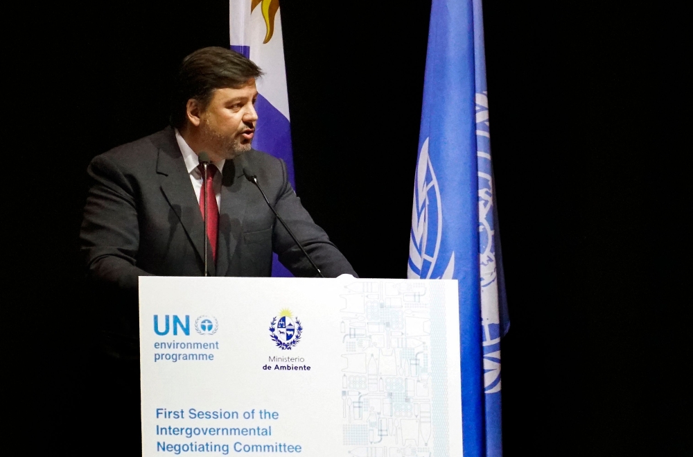 Uruguay's Minister of Environment Adrian Peٌa delivers a speech during the UN's First Session of the Intergovernmental Negotiating Committee (INC-1) to develop a legally binding instrument on plastic pollution, in Punta del Este, Maldonado department, Uruguay on November 28, 2022.  (Photo by STRINGER / AFP)