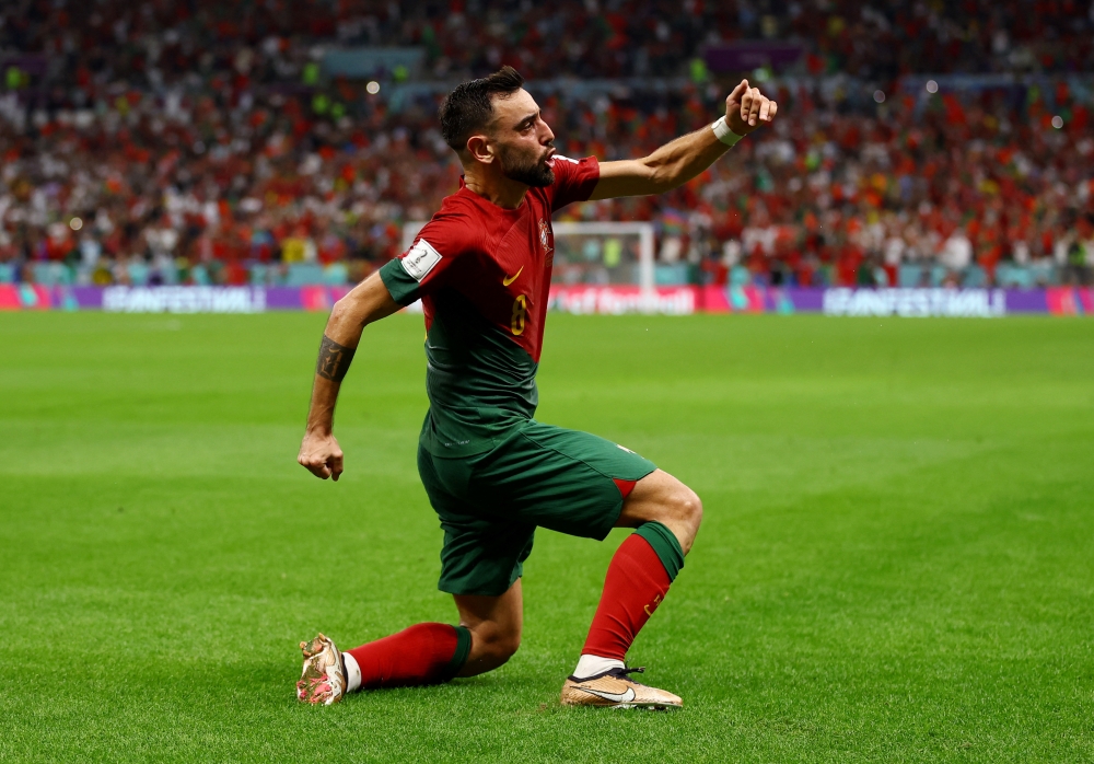 Portugal's Bruno Fernandes celebrates scoring their second goal during the FIFA World Cup Qatar 2022 Group H against Uruguay at the Lusail Stadium, Lusail, Qatar, on November 28, 2022.  REUTERS/Lee Smith