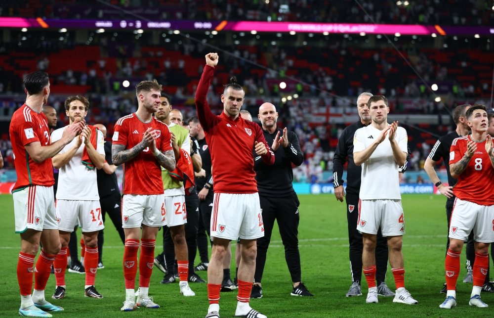 November 30, 2022 Wales manager Rob Page, Gareth Bale and Joe Rodon look dejected after the match as Wales are eliminated from the World Cup REUTERS/Lee Smith