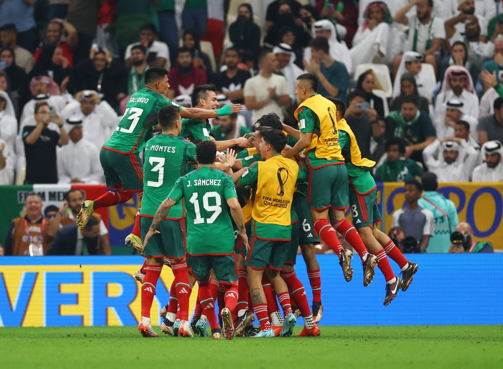 Mexico's Luis Chavez celebrates scoring their second goal with teammates during the 2022 Qatar World Cup final Group C match between Saudi Arabia and Mexico at the Lusail Stadium. (REUTERS/Kai Pfaffenbach)