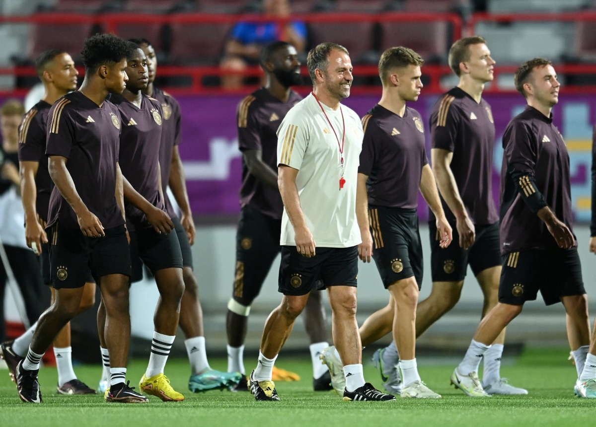 Germany coach Hansi Flick and players during a training session.