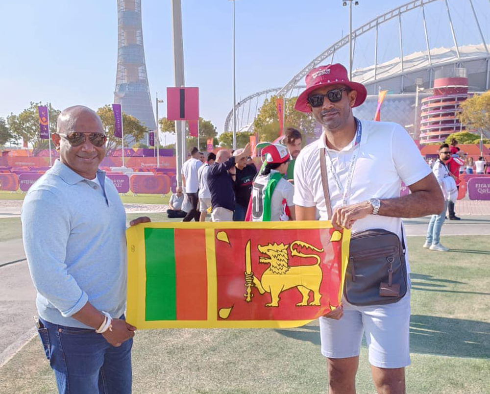 The duo pose for photographs outside Khalifa International Stadium.