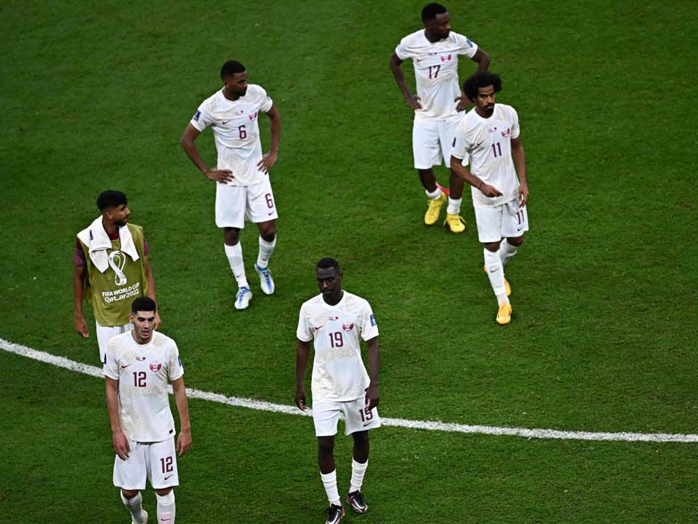 Qatar’s players react at the end of their match against the Netherlands. AFP