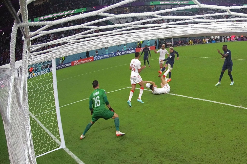 France's forward #07 Antoine Griezmann (2nd R) shoots to score a goal past Tunisia's goalkeeper #16 Aymen Dahmen (L) which was later disallowed for offside. Photo by Jewel Samad / AFP