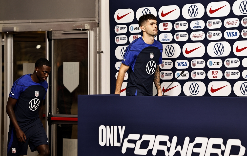 Timothy Weah and Christian Pulisic of the US arrive for a press conference at the Al Gharafa SC Stadium, Al Rayyan, Qatar, on December 1, 2022.  REUTERS/Hamad I Mohammed