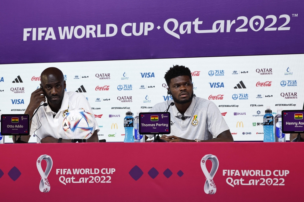 Ghana's coach Otto Addo (left) and Ghana's midfielder Thomas Partey give a press conference at the Qatar National Convention Center (QNCC) in Doha on December 1, 2022, on the eve of the Qatar 2022 World Cup football match between Ghana and Uruguay. (Photo by Khaled DESOUKI / AFP)