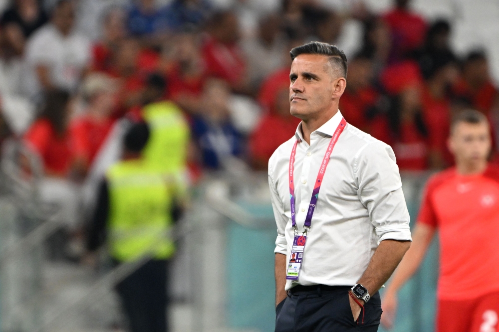 Canada's coach John Herdman walks on the pitch before the Qatar 2022 World Cup Group F football match between Canada and Morocco at the Al-Thumama Stadium in Doha on December 1, 2022. (Photo by Patrick T. Fallon / AFP)