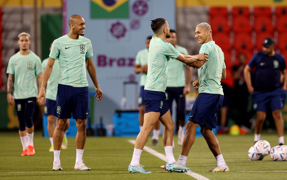 Brazil's Richarlison, Alex Telles and Fabinho during training at the  Al Arabi SC Stadium, Doha, Qatar, on December 1, 2022.  REUTERS/Amanda Perobelli