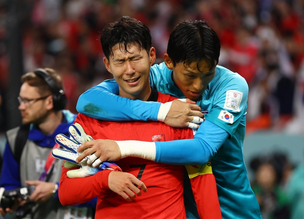 South Korea's Son Heung-min and Kim Seung-gyu celebrate after the match as South Korea qualify for the knockout stages Reuters/Matthew Childs