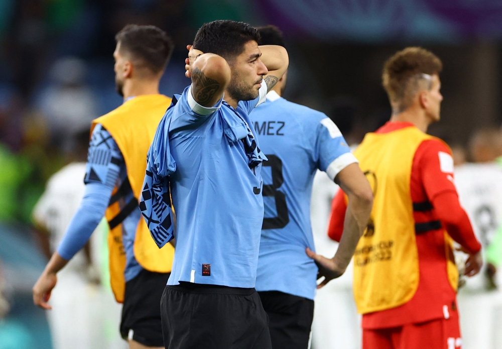 Uruguay's Luis Suarez looks dejected after the FIFA World Cup Qatar 2022 - Group H match against Ghana as Uruguay are eliminated from the World Cup at the Al Janoub Stadium, Al Wakrah, Qatar, on December 2, 2022. REUTERS/Siphiwe Sibeko