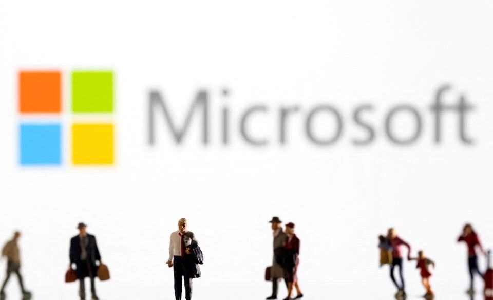 Small figurines are seen in front of displayed Microsoft logo in this illustration taken February 11, 2022. File Photo / Reuters