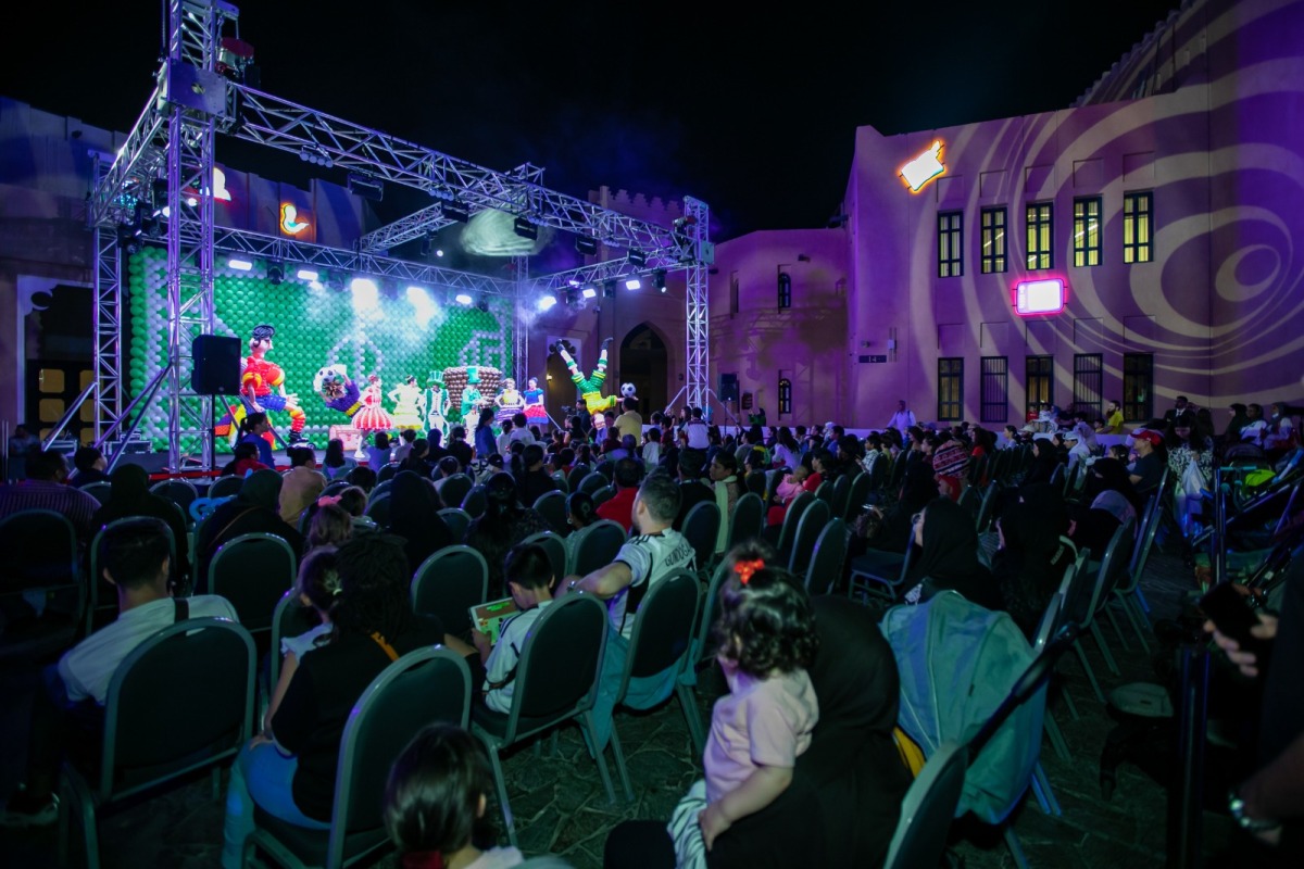 People attend a performance at Cultural Village Foundation Katara.