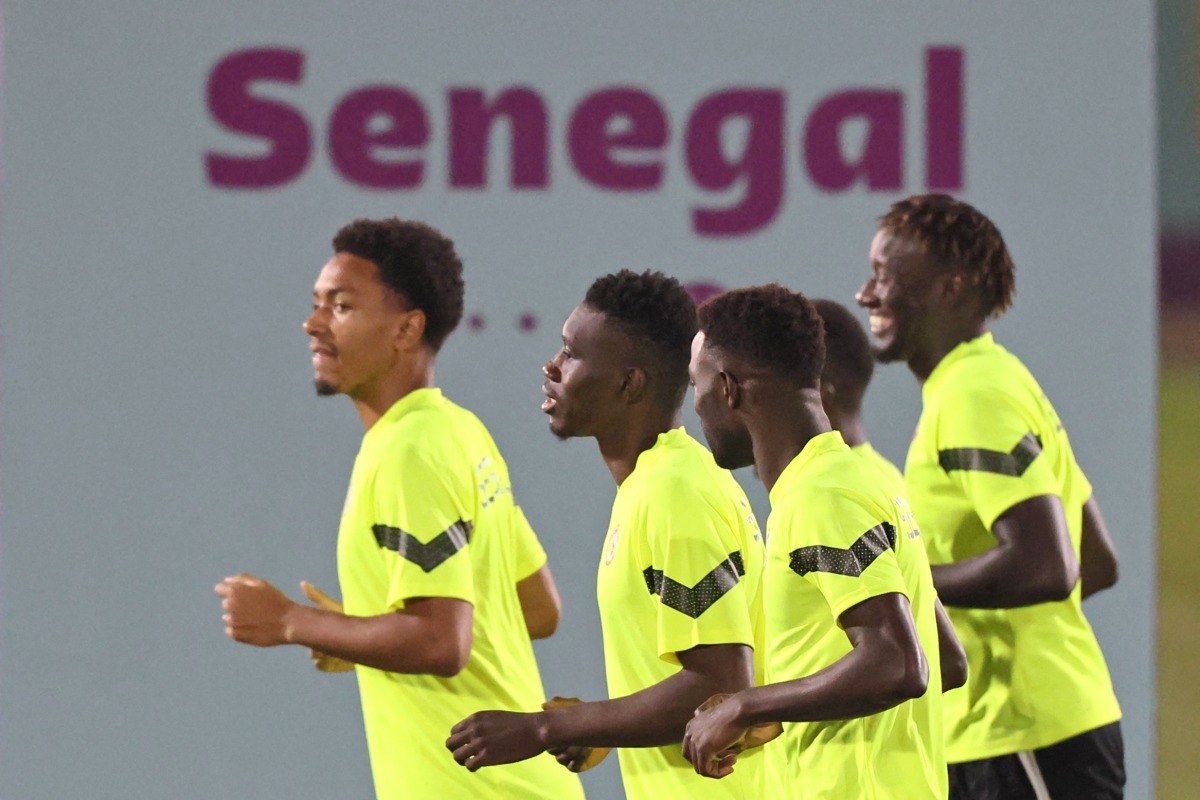 From left: Senegal’s defender Abdou Diallo, forward Ismaila Sarr, midfielder Moustapha Name and forward Famara Diedhiou attend a training session at Al Duhail SC, yesterday.  AFP