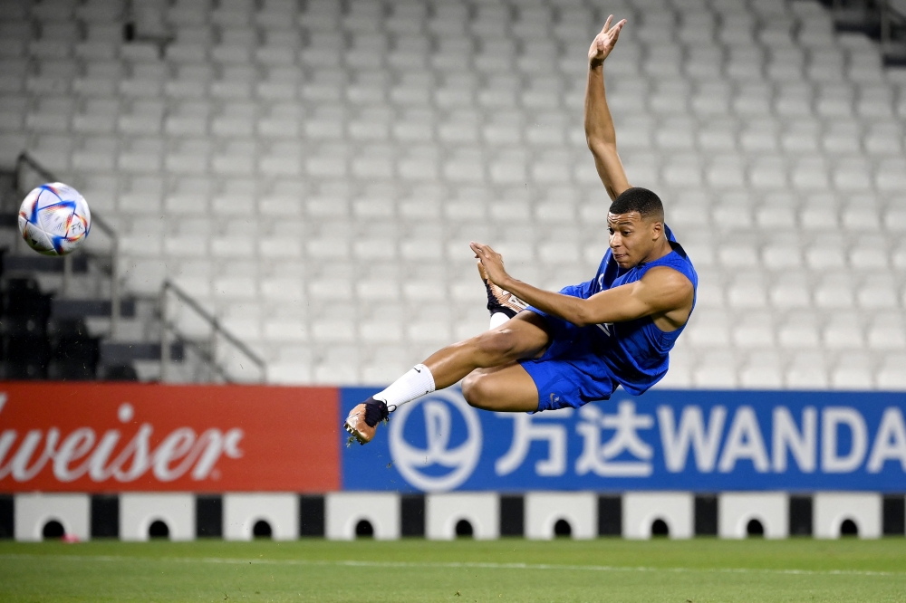 France's forward Kylian Mbappe kicks the ball during a training session at the Jassim-bin-Hamad Stadium in Doha on December 2, 2022, during the Qatar 2022 World Cup football tournament. (Photo by FRANCK FIFE / AFP)