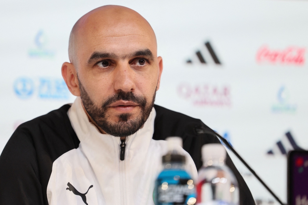 Morocco's coach Hoalid Regragui attends a press conference at the Qatar National Convention Center (QNCC) in Doha on December 5, 2022, on the eve of the Qatar 2022 World Cup Round of 16 football match between Morocco and Spain. (Photo by KARIM JAAFAR / AFP)