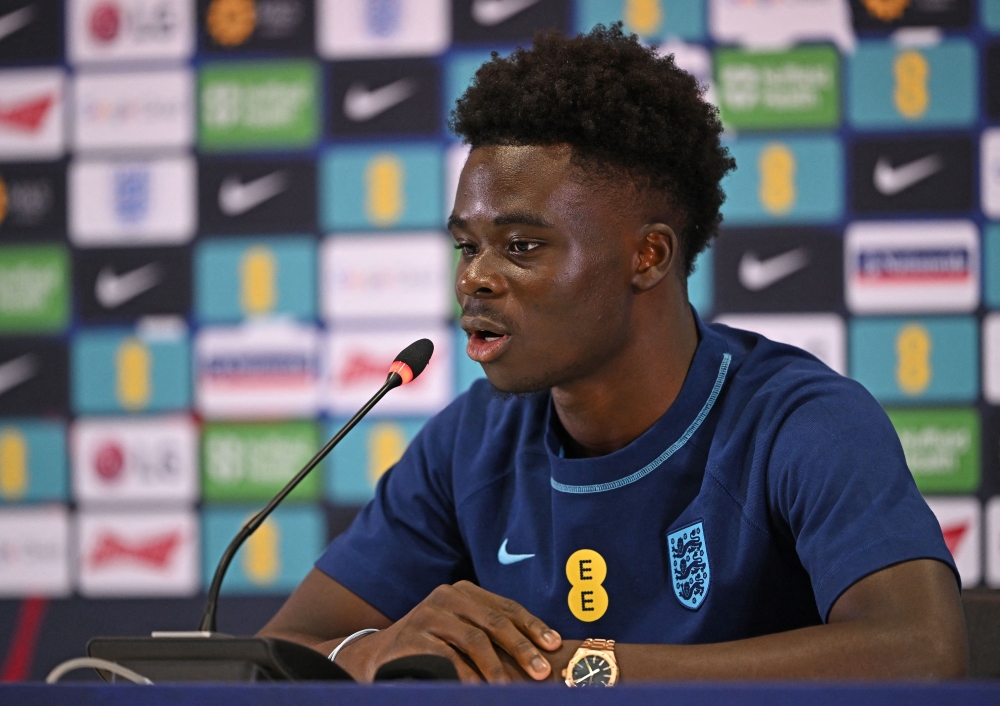 England's Bukayo Saka attends a press conference at Al Wakrah SC Stadium in Al Wakrah, south of Doha on December 5, 2022 during the Qatar 2022 World Cup football tournament. (Photo by Paul ELLIS / AFP)