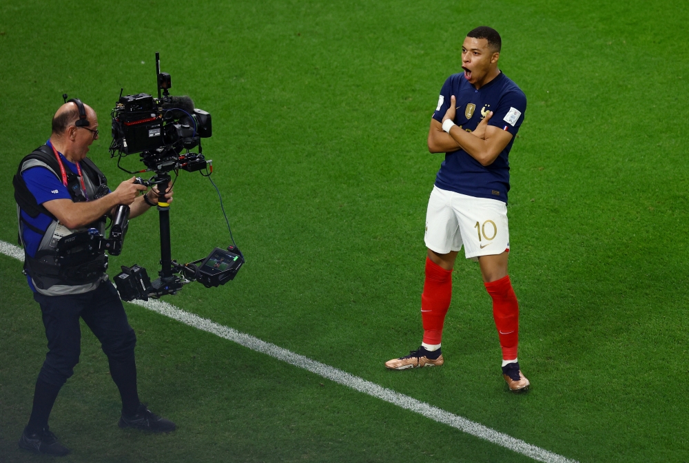 France's Kylian Mbappe celebrates scoring their third goal during the FIFA World Cup Qatar 2022 Round of 16 match against Poland at the Al Thumama Stadium, Doha, Qatar, on December 4, 2022.  REUTERS/Lee Smith