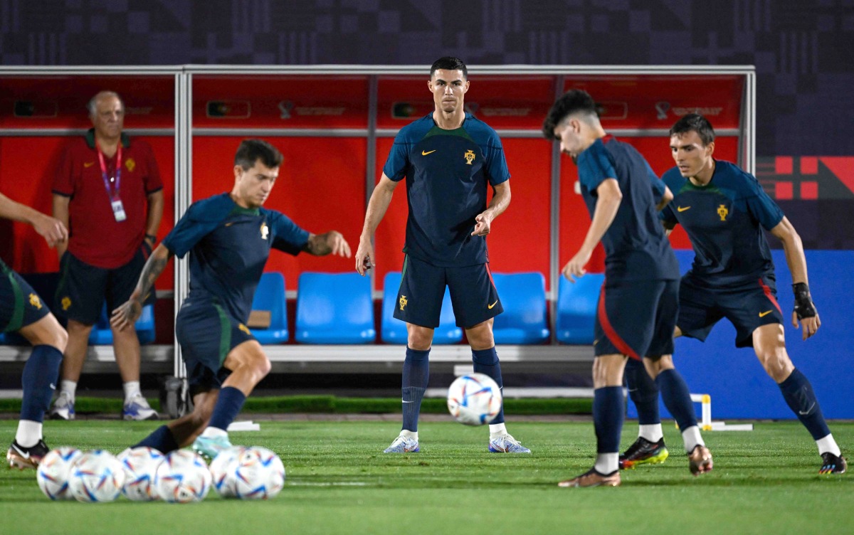 Portugal's Cristiano Ronaldo (centre) and his teammates take part in a training session at the Al Shahaniya SC training site, yesterday. AFP