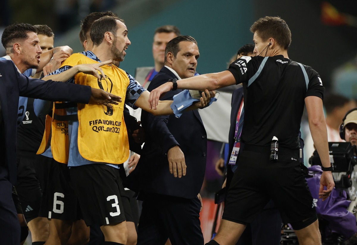 Uruguay’s Diego Godin remonstrates with referee Daniel Siebert after the match.