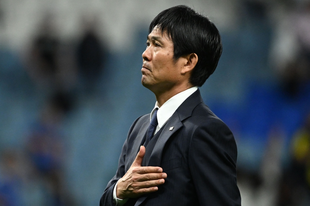 Japan's coach #00 Hajime Moriyasu greets the fans after his team's defeat in the Qatar 2022 World Cup round of 16 football match between Japan and Croatia at the Al-Janoub Stadium in Al-Wakrah, south of Doha on December 5, 2022. (Photo by Ina Fassbender / AFP)