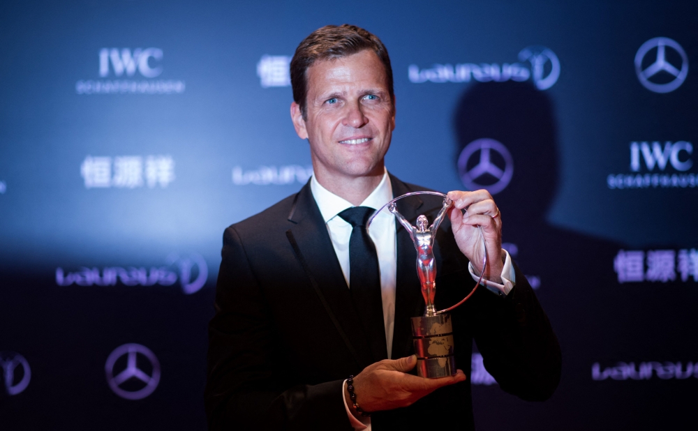 This file photo taken on April 15, 2015 shows Oliver Bierhoff, manager of the German national football team, posing with the Laureus World Sports Team of the Year Award during the Laureus World Sports Award ceremony at the Grand Theater in Shanghai.  (Photo by JOHANNES EISELE / AFP)