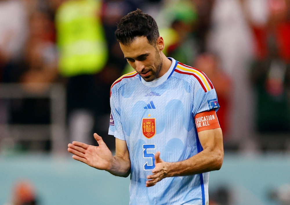 Spain's Sergio Busquets looks dejected after his penalty is saved by Morocco's Yassine Bounou during the FIFA World Cup Qatar 2022 Round of 16 penalty shootout at the Education City Stadium, Al Rayyan, Qatar, on December 6, 2022. REUTERS/Matthew Childs