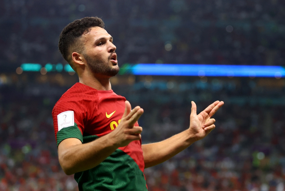 Portugal's Goncalo Ramos celebrates scoring their fifth goal and his hat-trick during the FIFA World Cup Qatar 2022 Round of 16 match against Switzerland at the Lusail Stadium, Lusail, Qatar, on December 6, 2022  REUTERS/Hannah Mckay