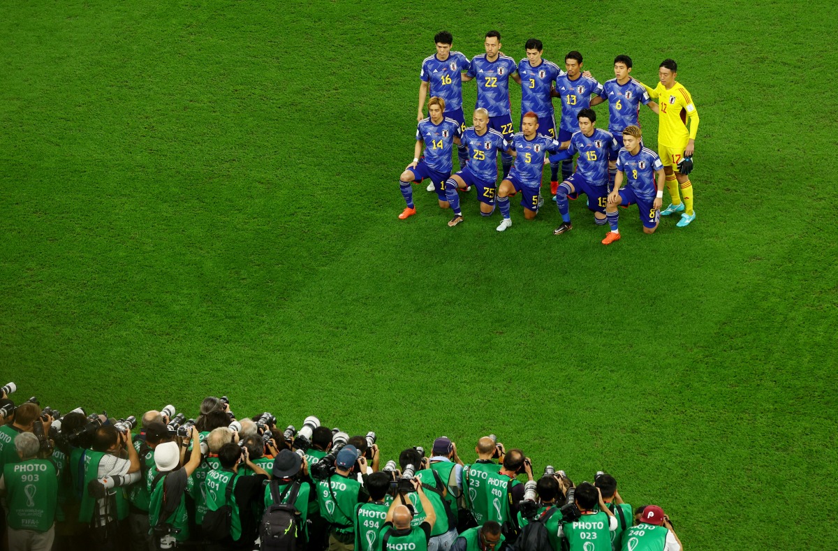 Japan players pose for a team group photo. Reuters